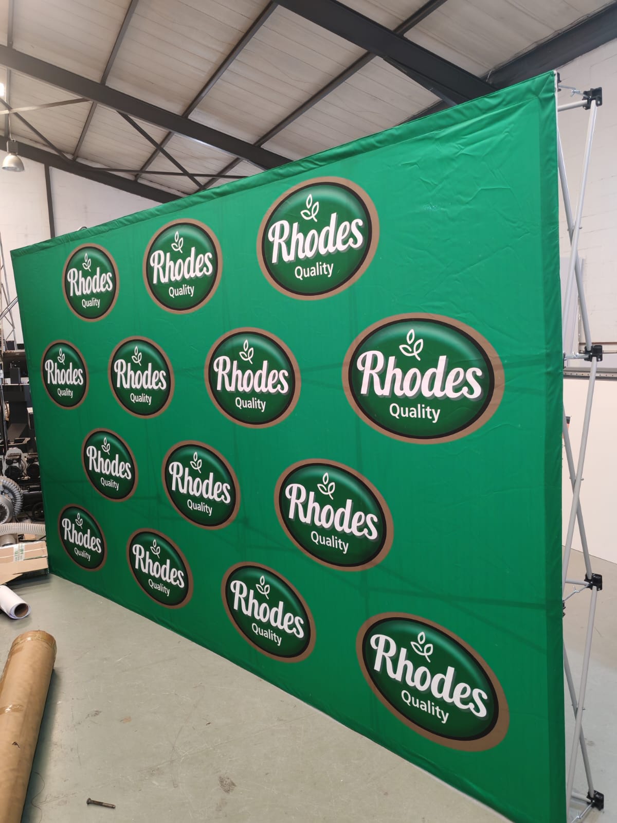 Rhodes Quality — Step-and-repeat photo-wall backdrop